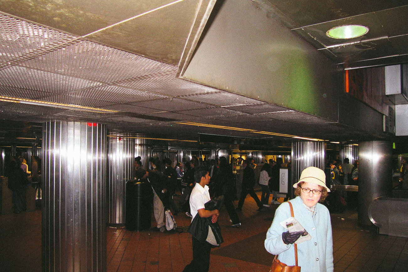Woman walking in a New York City subway station in May 2005.