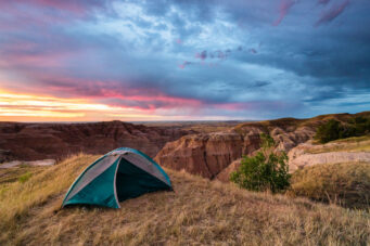 Sunrise over our tent at the Buffalo Gap National Grasslands. This Bureau of Land Management spot is one of our absolute favorite camping spots.