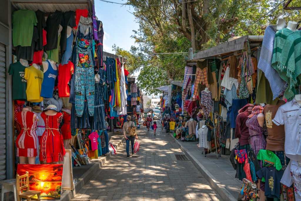 Market in Panajachel, Guatemala containing Mayan woven goods.