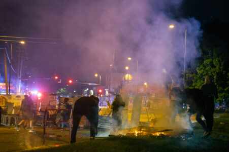 Barricades and a fire burns on the Target property on Minnehaha Ave during the 2nd day of protests in Minneapolis following the death of George Floyd.