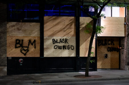 Boards on businesses in Downtown Minneapolis that read “BLM” “BLACK OWNED” on the 4th day of protests in Minneapolis following the death of George Floyd.
