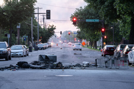 Debris in the road from fires as the sunrises over Pillsbury Ave in South Minneapolis on May 30, 2020 following the 4th day of protests in Minneapolis following the death of George Floyd.
