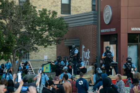 Protesters and Minneapolis police outside the third precinct on May 27th, 2020, the second day of protests following the death of George Floyd.