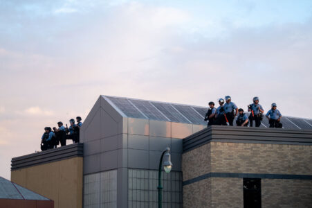 Minneapolis Police on the roof of the 3rd Precinct as protesters gathered outside following the killing of George Floyd days earlier.