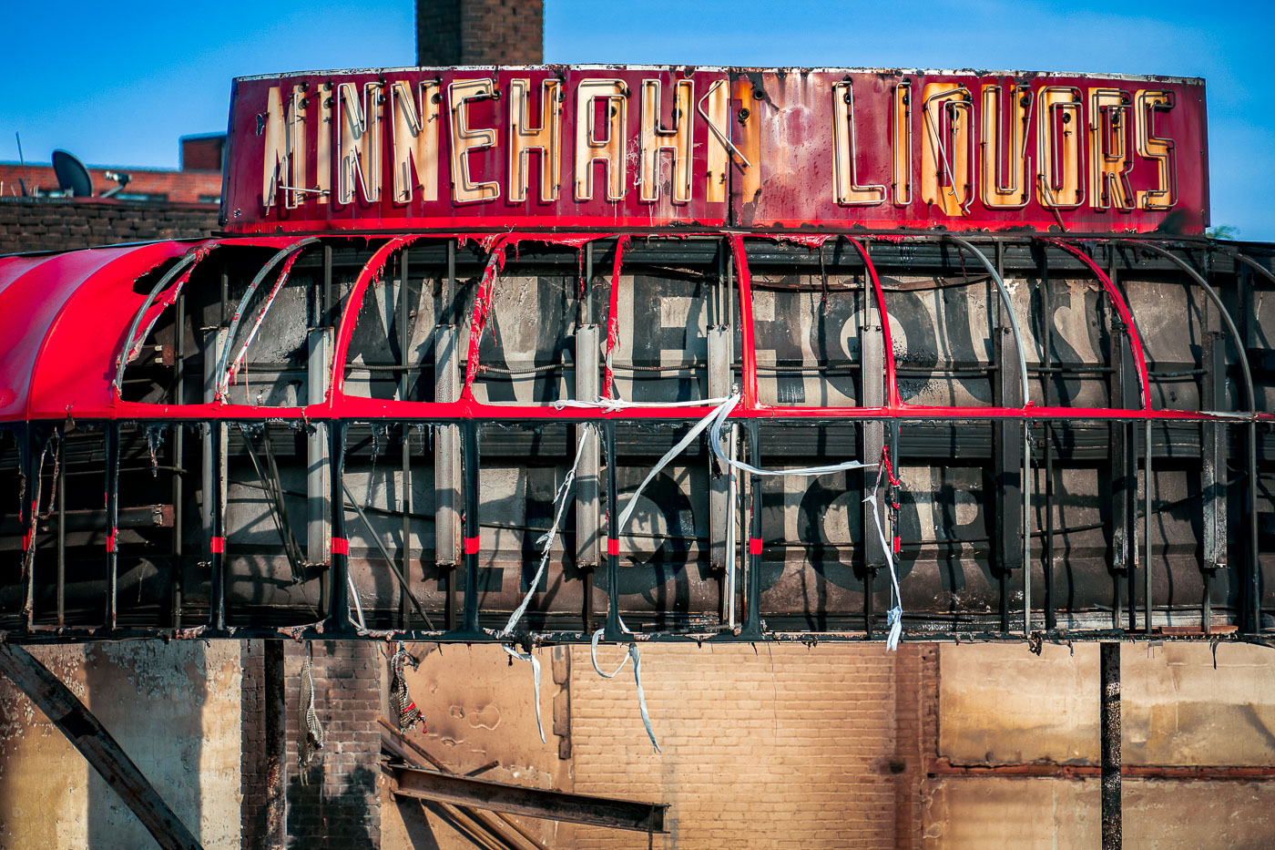 Minnehaha Liquors sign after fire during George Floyd protest