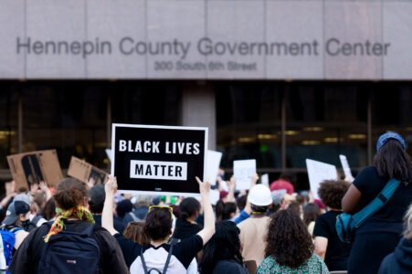 A protester holds up a sign reading "Black Lives Matter" outside the Hennepin County Government Center on May 28, 2020.