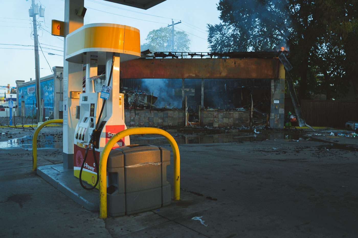 Shell gas station on fire on Lake Street as sun rises