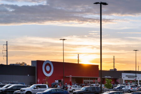 The sun sets behind Target, across from the Minneapolis police 3rd precinct.