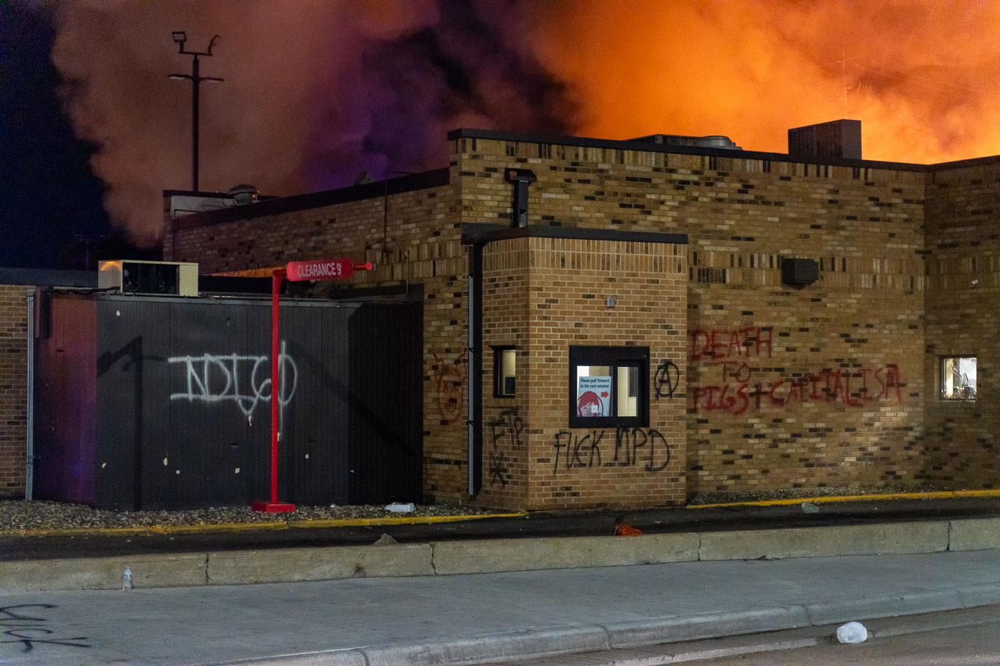 Wendy’s on fire with graffiti on the side