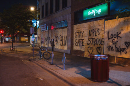 Boards reading "Stay Safe" "MPLS Strong" "Look for the helpers" "BLM" on the Iron Door Pub on Lyndale Ave in Uptown Minneapolis during protests following the murder of George Floyd. May 2020.