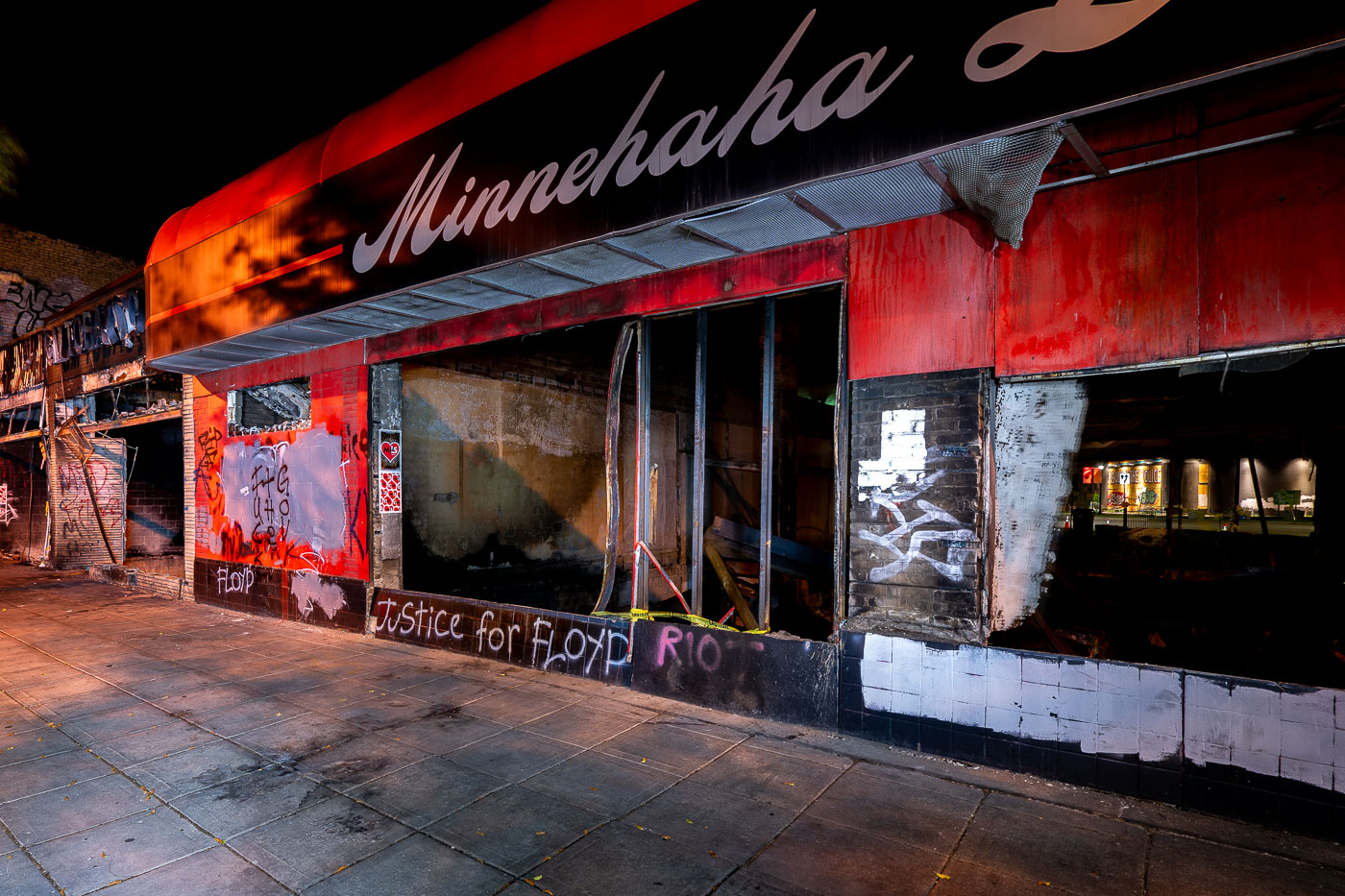 Exterior photo of burned out Minnehaha Liquors store