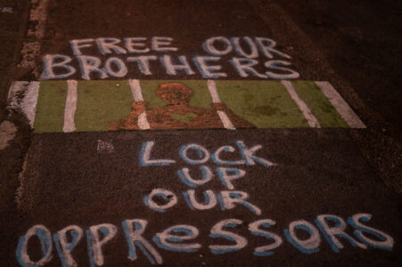 "Free our brothers. Lock up our oppressors" writer on Chicago Ave.