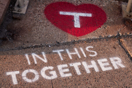 Stencil art placed by the Metro Transit outside their building in the North Loop. 

“In this together”