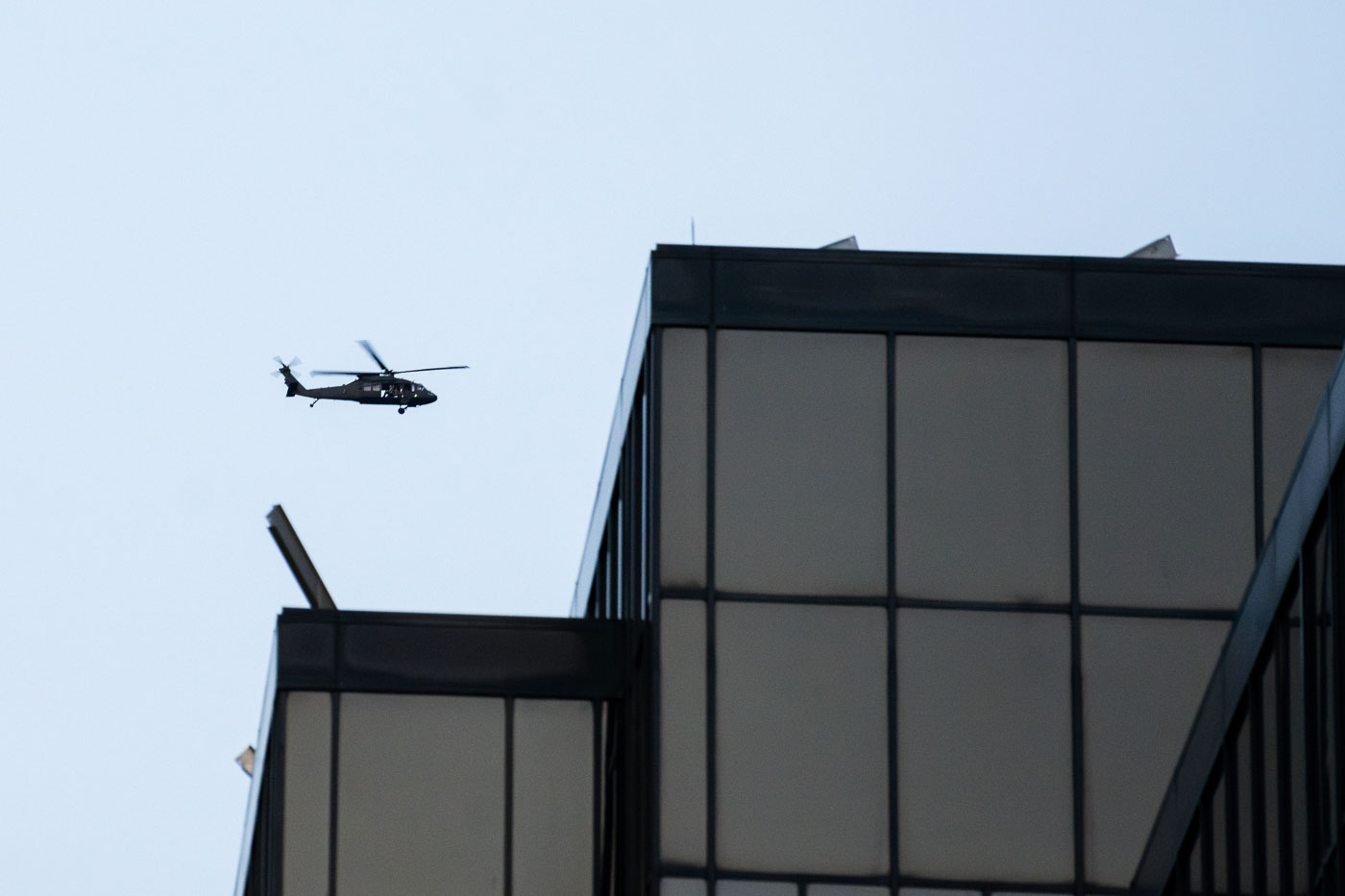 Military helicopter over the IDS Center in Minneapolis