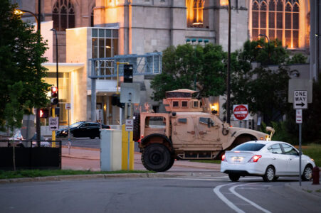 A National Guard vehicle drives through Downtown Minneapolis after days of unrest following the May 25th, 2020 death of George Floyd.
