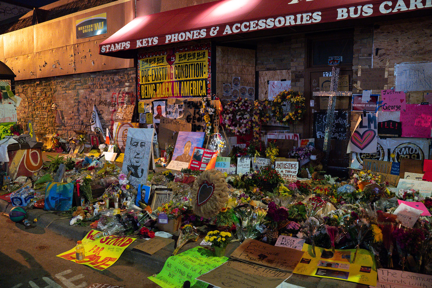 Protest and memorial signs outside of Cup Foods