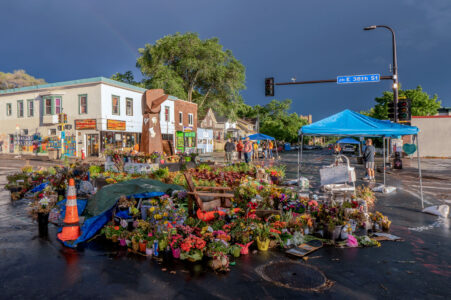 George Floyd memorial outside of Cup Foods on Chicago Ave/38th Street in South Minneapolis. Rainbow slightly visible as a storm moves through.