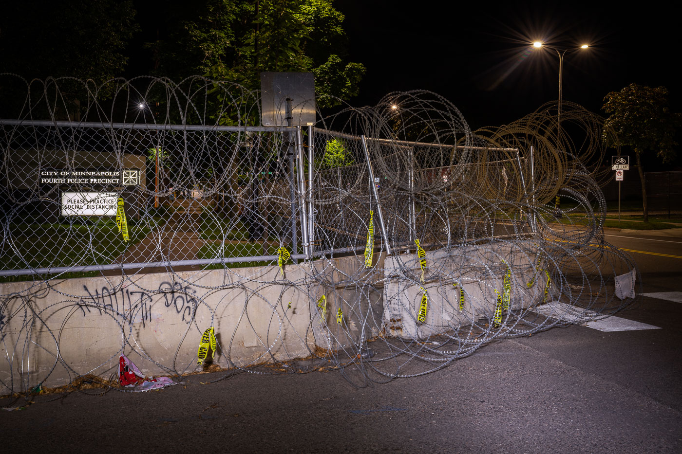 Razor wire and barricades surrounding police station