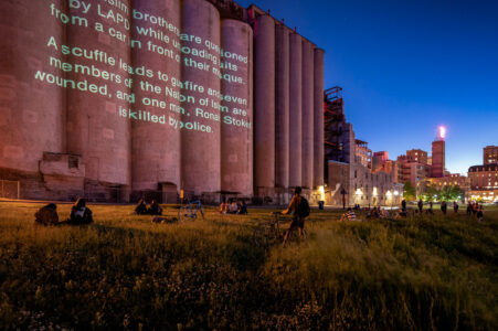 Projection on the Gold Medal Flour concrete elevators near downtown Minneapolis.

“Revolution Will Be Televised”