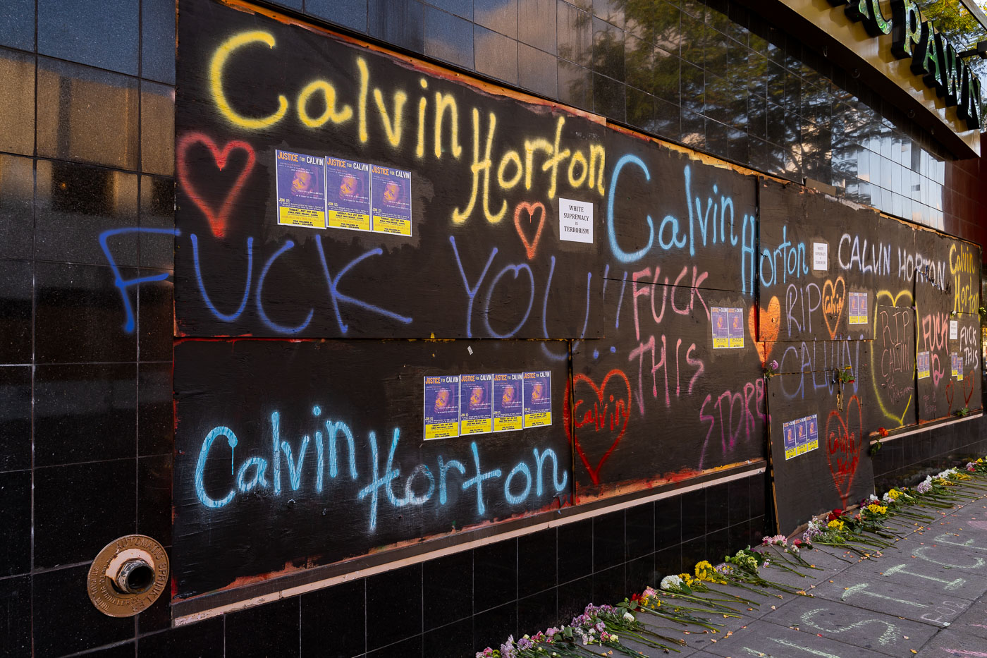 Calvin Horton written on boards over Cadillac Pawn windows