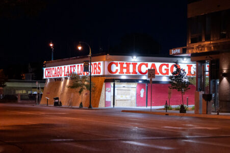 Chicago Lake Liquors on Lake Street with boards over the windows.