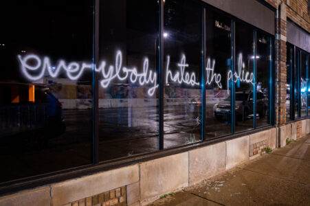 “Everybody hates the police” written on the windows of a downtown Minneapolis building.