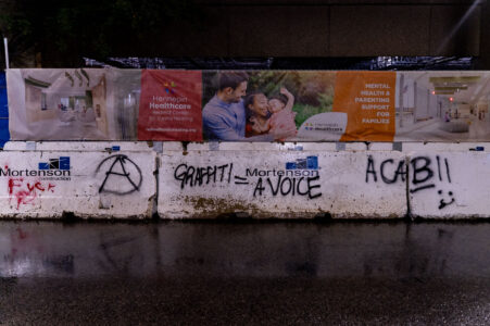 "Graffiti = A Voice" written on concrete barricades in Downtown Minneapolis.