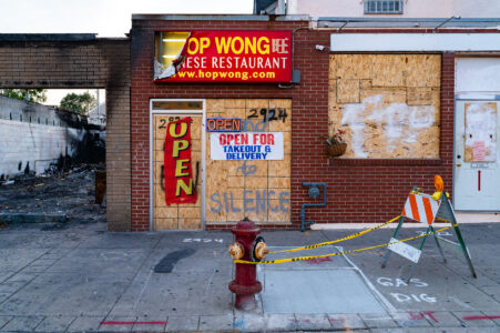 Hop Wong Chinese Restaurant on Chicago Ave with boards on it after the May 25th, 2020 death of George Floyd.