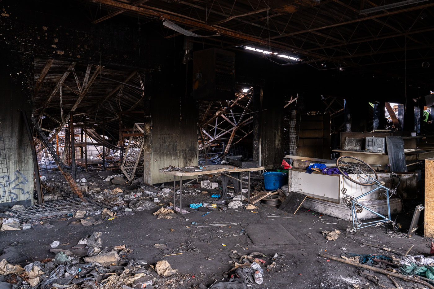 Photo of trash inside burned out building
