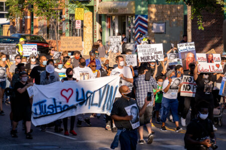 Protesters march to Minneapolis City Council member Alondra Cano's home on what would have been Calvin Horton's 44th birthday. Calvin was shot and killed by the owner of Cadillac Pawn on May 27th during the unrest over the May 25th death of George Floyd.