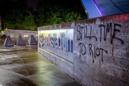 “Still time to riot” written on the side of US Bank Stadium in Downtown Minneapolis.