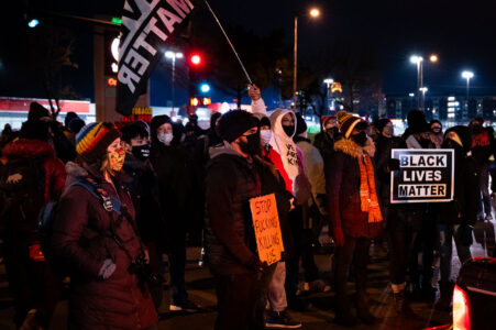Protesters march from South High School to the Minneapolis Third Precinct in solidarity with Philadelphia after the killing of Walter Wallace Jr.