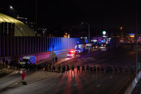 Minnesota State Patrol form a line across Interstate 94 in Minneapolis prior to arrest 646 who had been marching on the night after the election down the freeway.