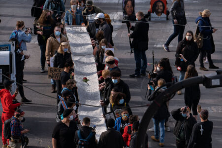 The day before Derek Chauvin goes on trial in Minneapolis for the murder of George Floyd a thousand march from the Government Center and down Hennepin Ave with a scroll that has 470+ names of people killed by MN police. Organizers point out Chauvin was involved in 5 of the names.