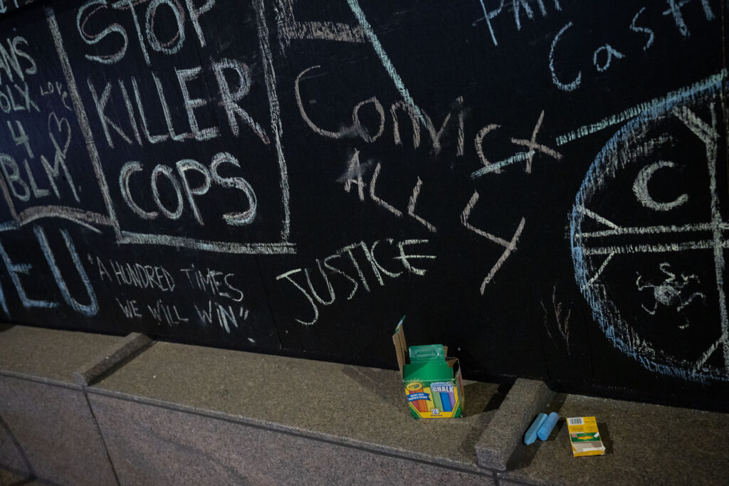 Chalk laying outside a building across the street from the Hennepin County Government Center where the trial of Derek Chauvin has begun. Chauvin is charged in the May 25th, 2020 murder of George Floyd.