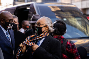 Rev Al Sharpton arrives with the George Floyd family for a press conference outside the Hennepin County Government Center where opening statements in the Derek Chauvin were set to begin an hour later.