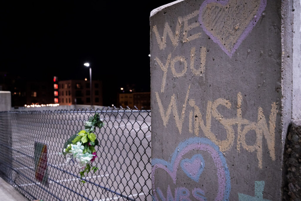"We love you winston" written on a pillar next to where he was shot and killed on June 3rd, 2021.