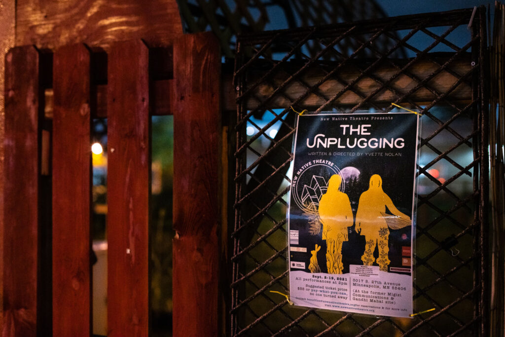 A flyer for The Unplugging by New Native Theatre at the site of the former Gandhi Mahal Site that burned down during unrest.