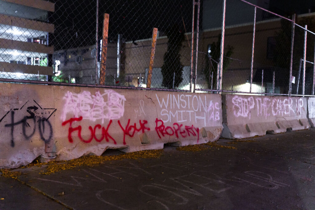 Graffiti on concrete barriers around the parking garage that Winston Smith was killed on June 3rd, 2021 by law enforcement.