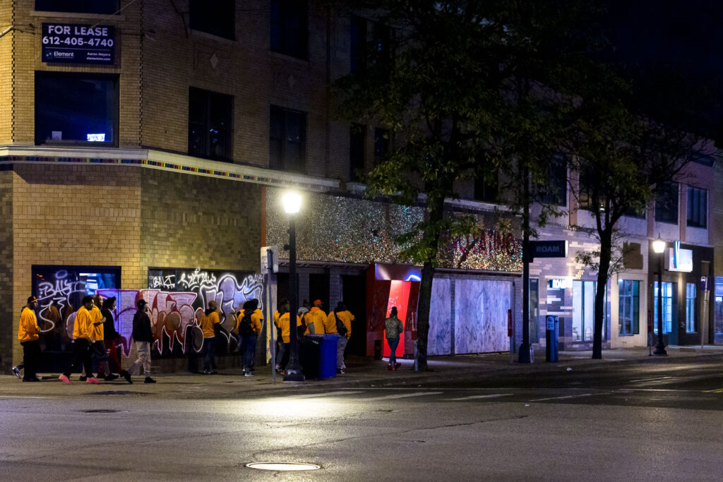 "Outreach" workers walking in Uptown Minneapolis.