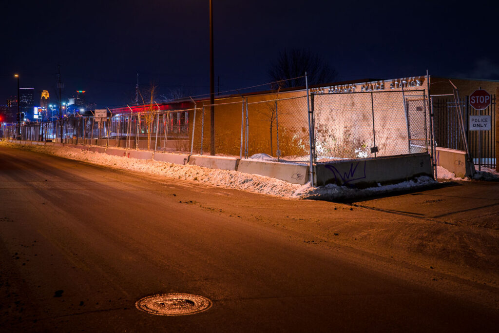 Minneapolis Police Fifth Precinct Police Station behind security fencing in January 2022.