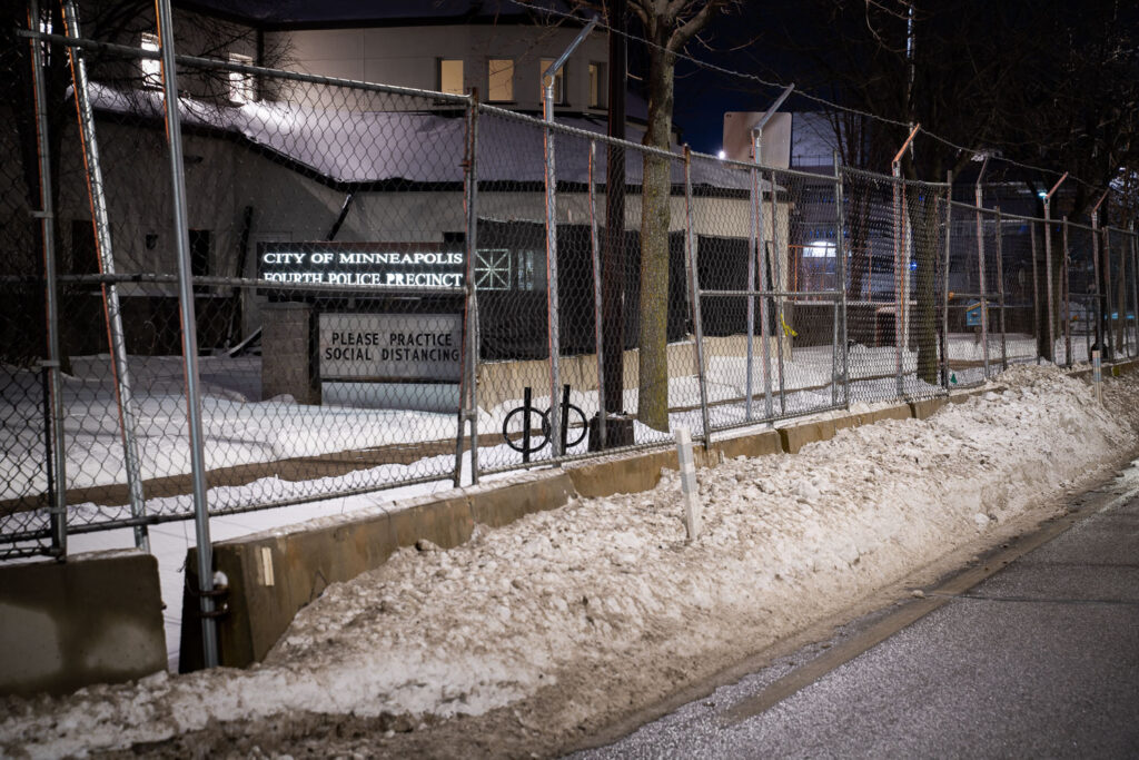 Minneapolis Police Fourth Precinct Police Station behind security fencing in January 2022.