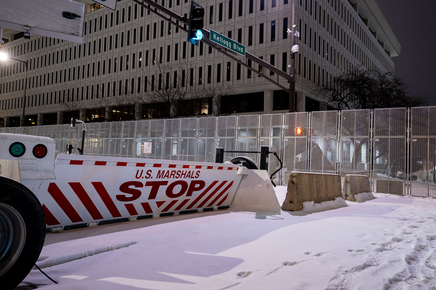 Security around the Warren E. Burger Federal Building in downtown St. Paul the night before opening statements in the federal trial of the officers accused of violating George Floyd's civil rights.