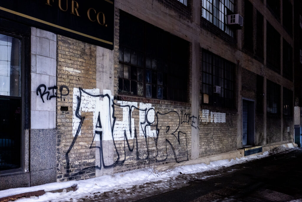 RIP Amir Locke written on a building across from the Minneapolis police 1st precinct.