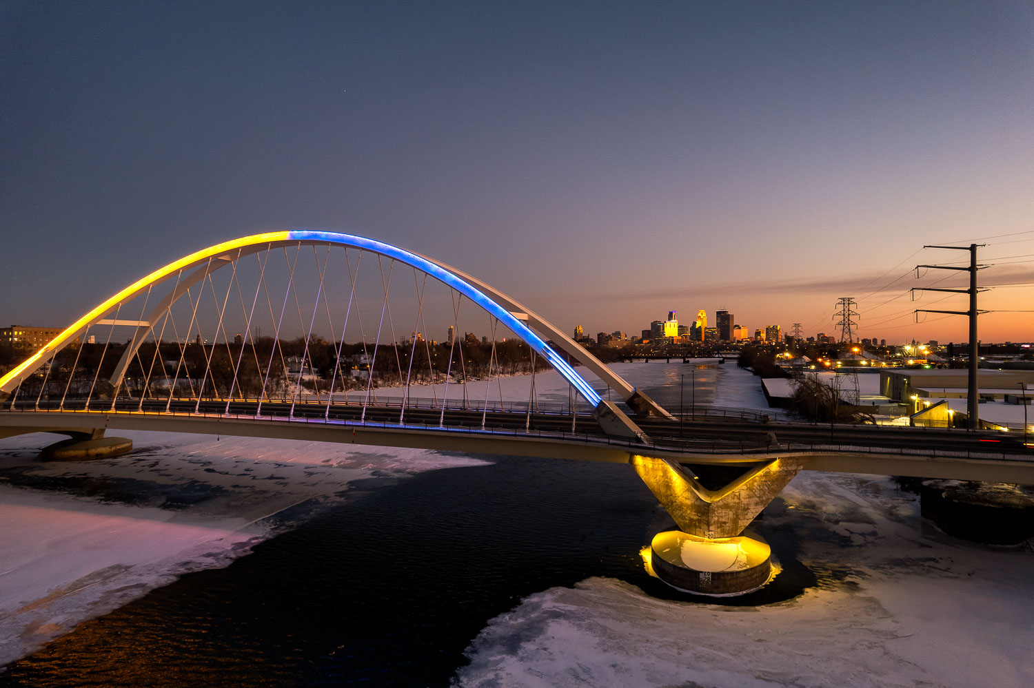 Lowry Avenue Bridge in Minneapolis during sunset tonight lit in yellow and blue in support of the people of Ukraine. The bridge is one of many structures around the city that are reportedly going to be lit in the colors of the Ukrainian flag this weekend.