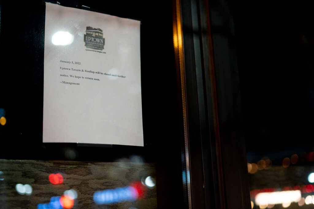 Sign regarding temporary closure of the Uptown Tavern bar after incidents of crime in the area.