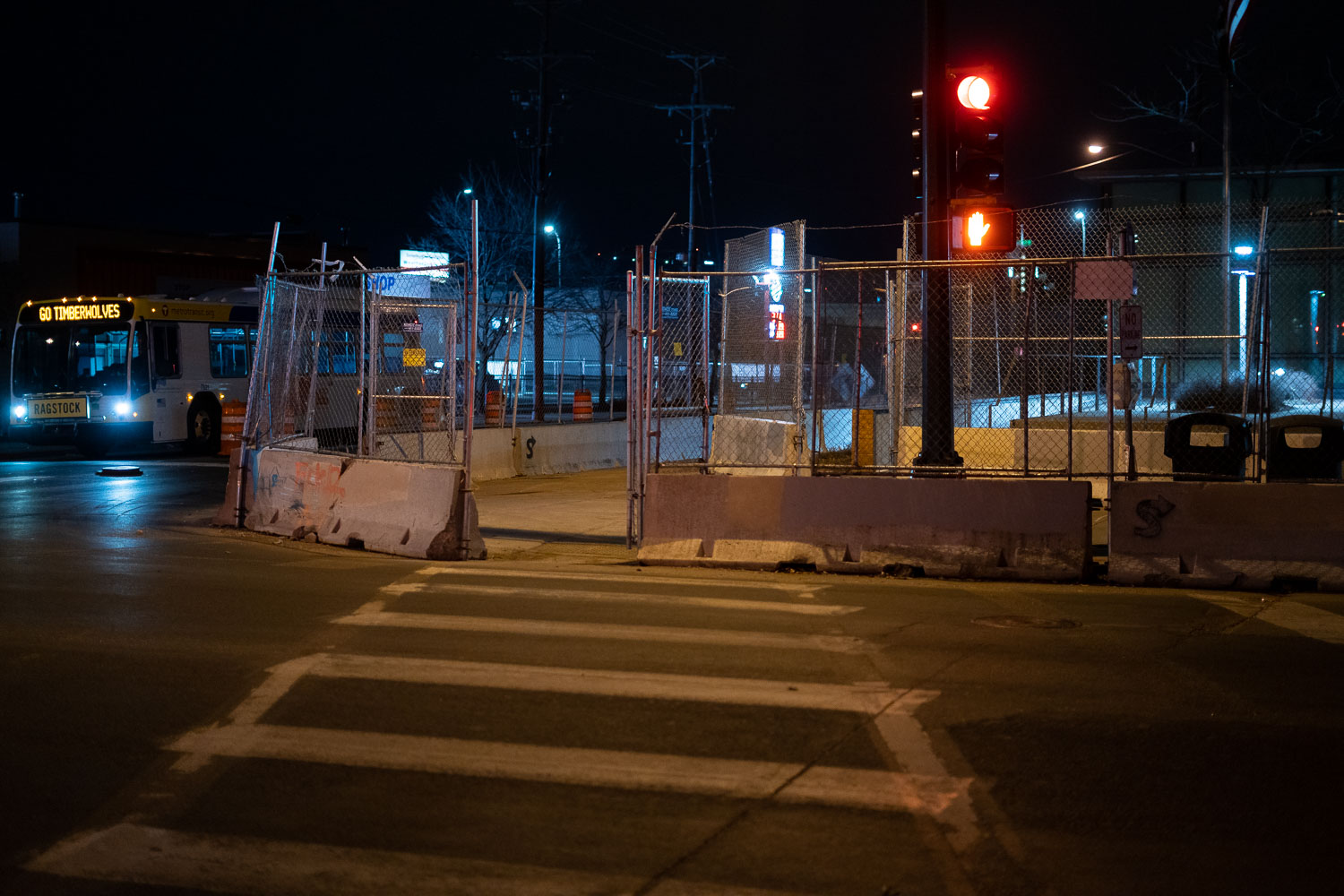 Minneapolis police fifth precinct behind barricades and fencing.