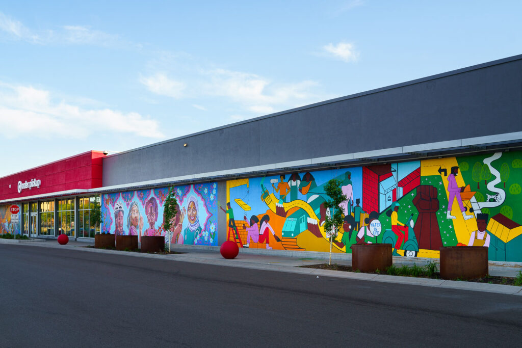 A mural on the Target Store across from the third precinct. "As part of our plan to reopen the store, we committed to co-creating permanent murals on the store’s exterior that reflect the Lake Street community." 7 local artists shared their interpretations of the words  "rooted, change, resilience, healing, growth, renewal and together."