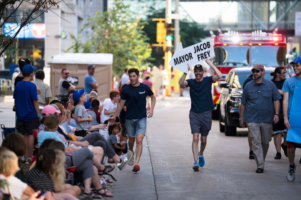 Minneapolis Mayor Jacob Frey running at the torchlight parade in downtown Minneapolis.