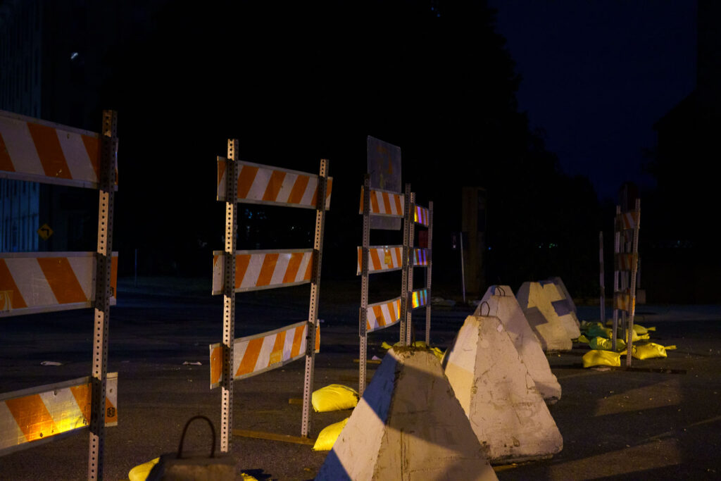 Barricades placed on sidewalks in downtown Minneapolis after "hot rodders" took over the area multiple weekends.